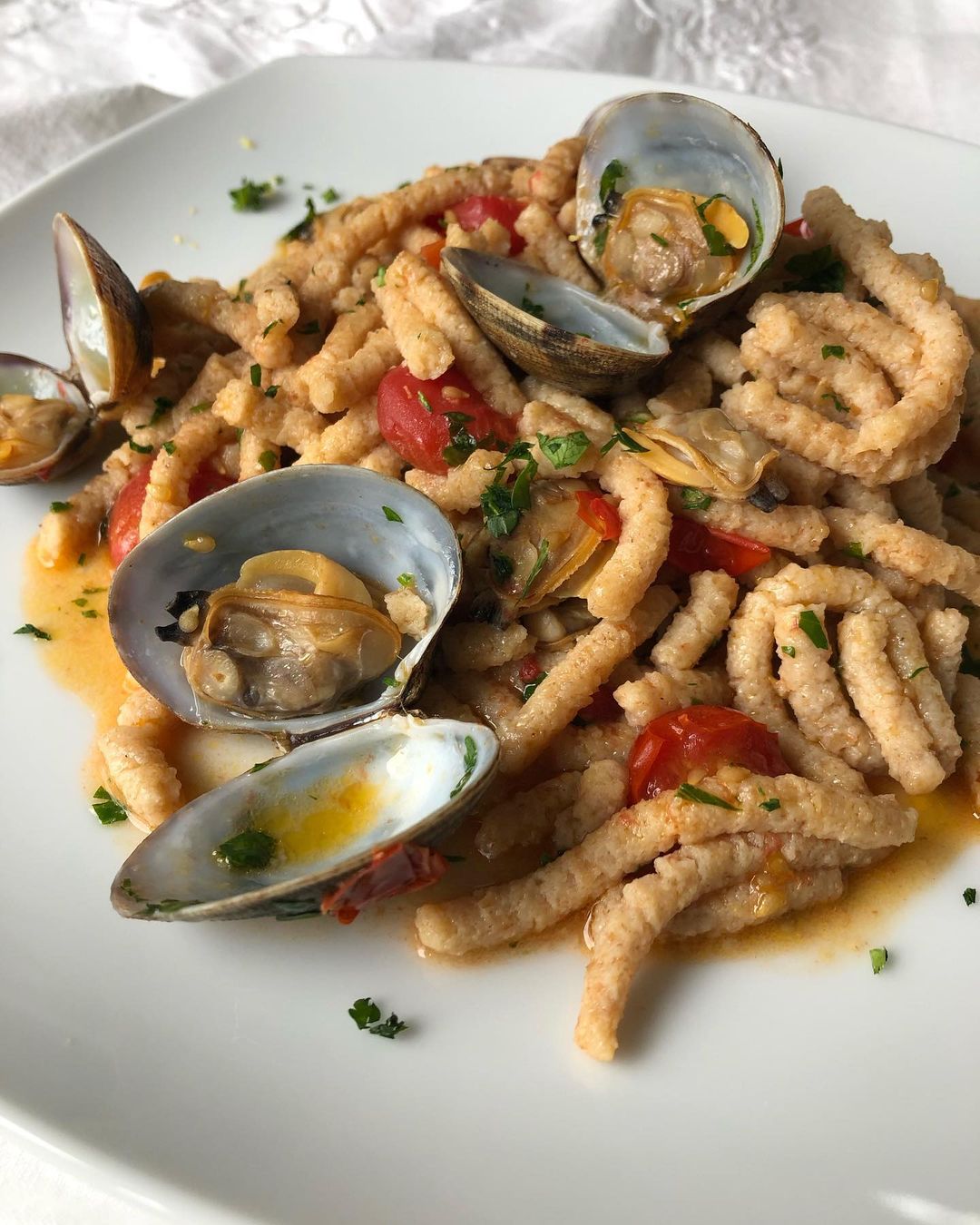 Passatelli asciutti con vongole e pomodorini | Ph. italian.homemade