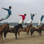 CHINA. Inner Mongolia. Equestrians acrobats rehearsing. 1979.